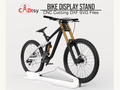 A sleek metal bike stand, made from a DXF file, securely holding a mountain bike in a stylish display.