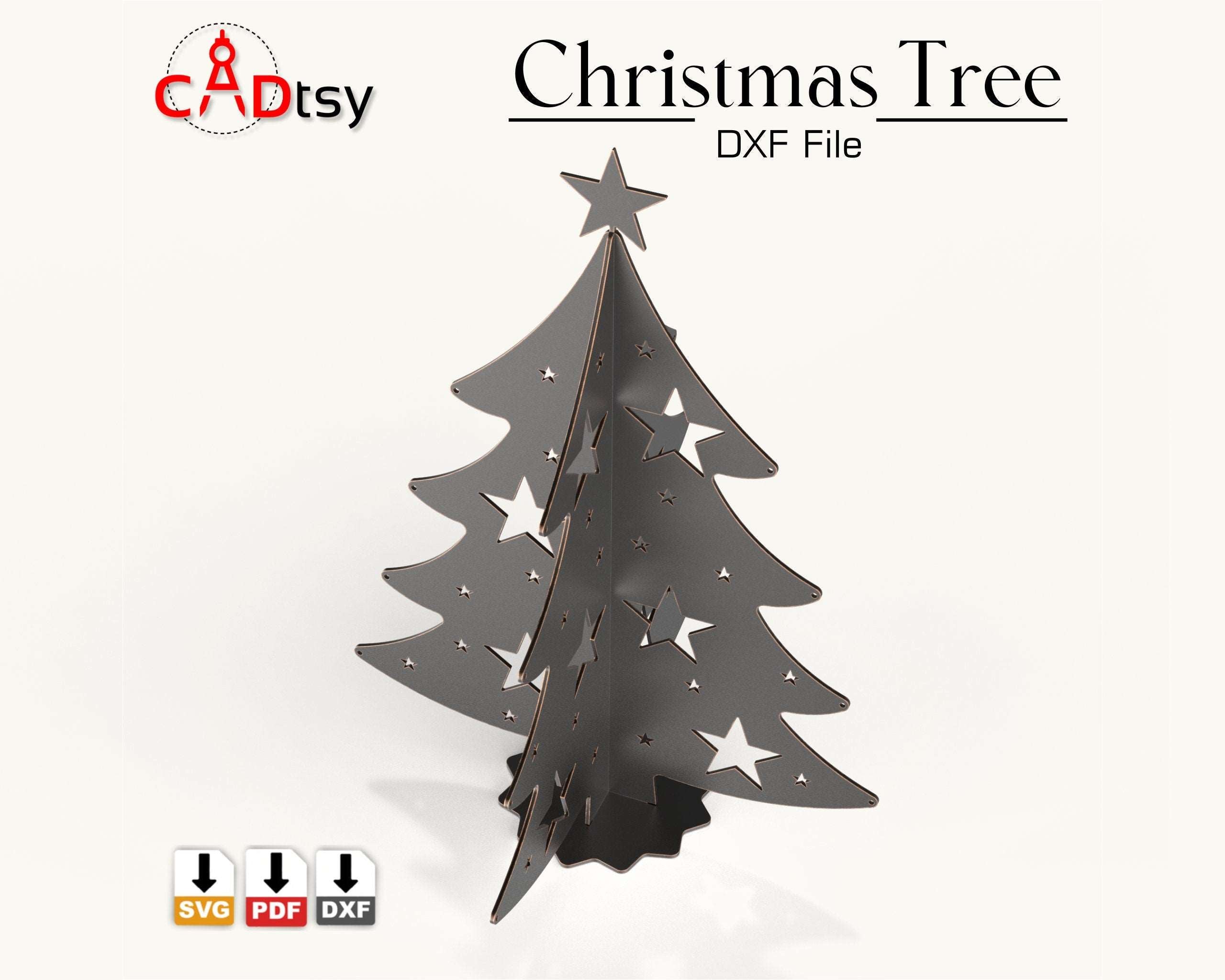 A 3D metal Christmas tree decoration, made from a DXF file, sitting on a table with festive lights in the background.