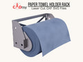 A metal paper towel rack, made from a DXF file, mounted on a wall and holding a large blue shop towel roll.