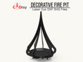A beautiful, decorative metal fire pit, made from a DXF file, glowing with a warm fire on a cozy autumn evening.